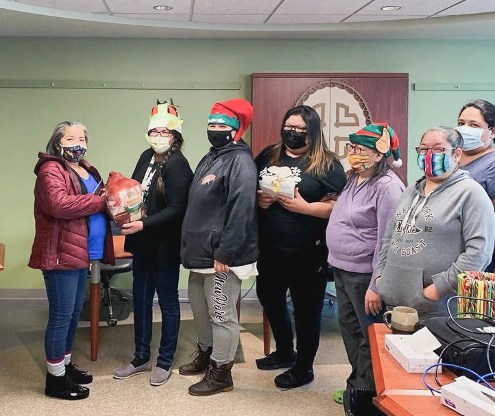 Wemindji CMC employees receive their turkeys.