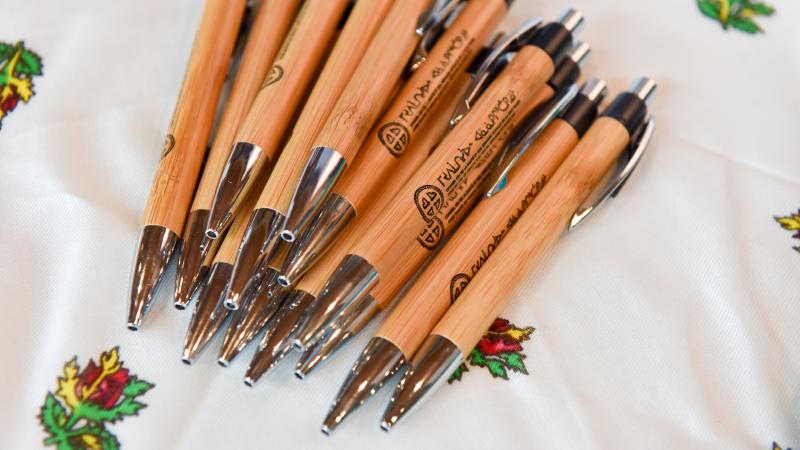 Cree Health Board branded pens piled on a table