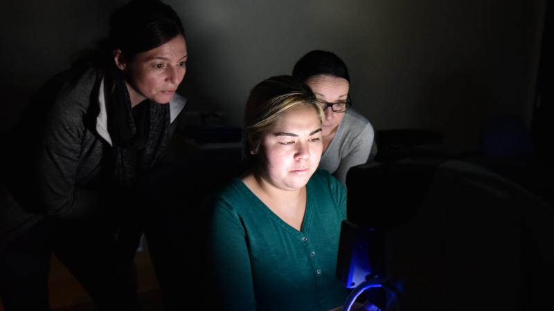 3 women looking at computer screen