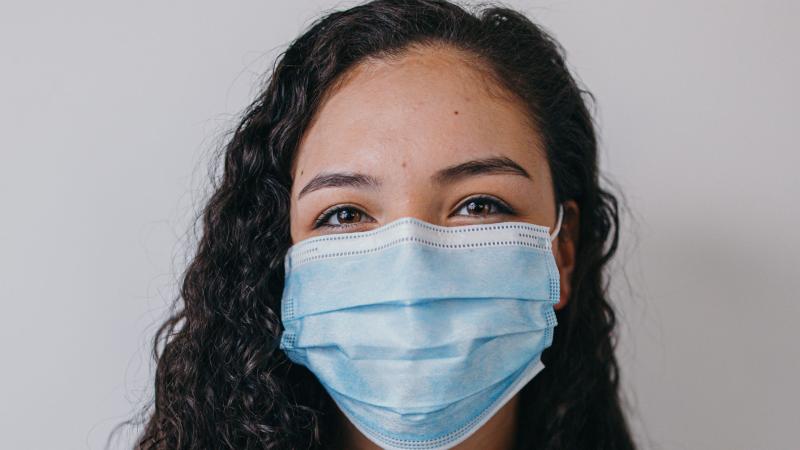 Woman wearing blue medical mask
