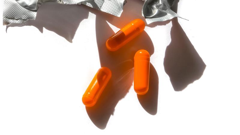 3 orange pills and foil wrapping