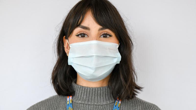 Maitee Saganash wears a medical mask that covers her nose and mouth snugly