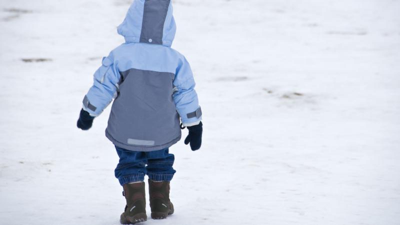 Child walking in snow
