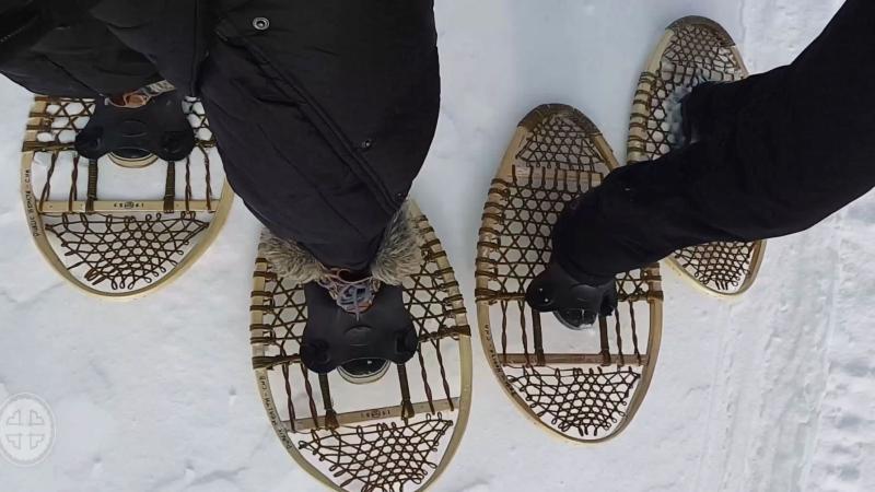 2 people walking with snowshoes