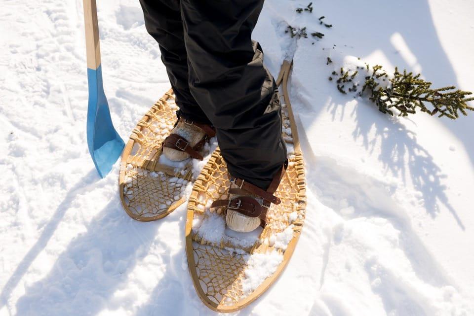 Standing in snow with snowshoes