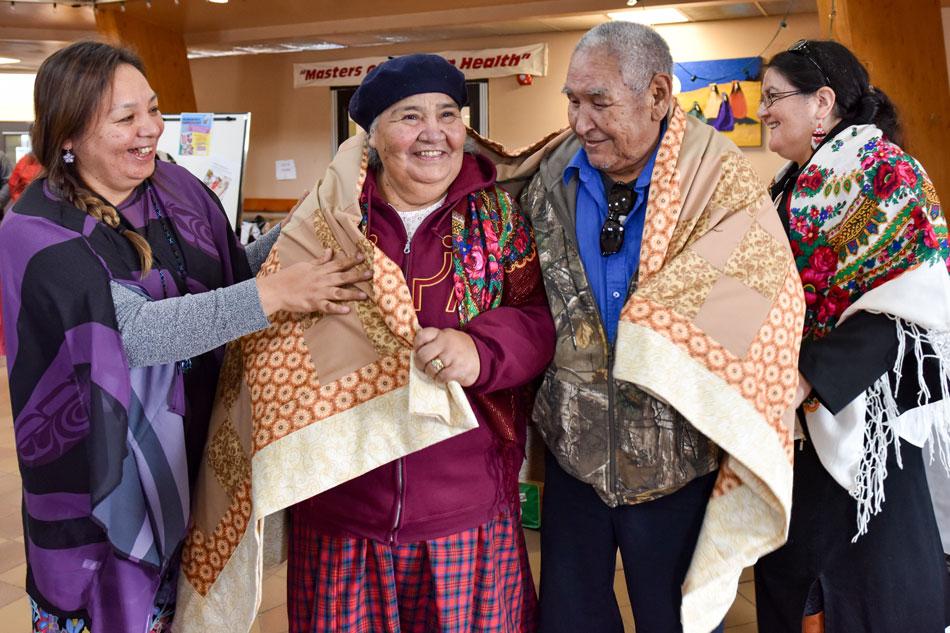 Elders receive ceremonial blankets from Nishiyuu Department