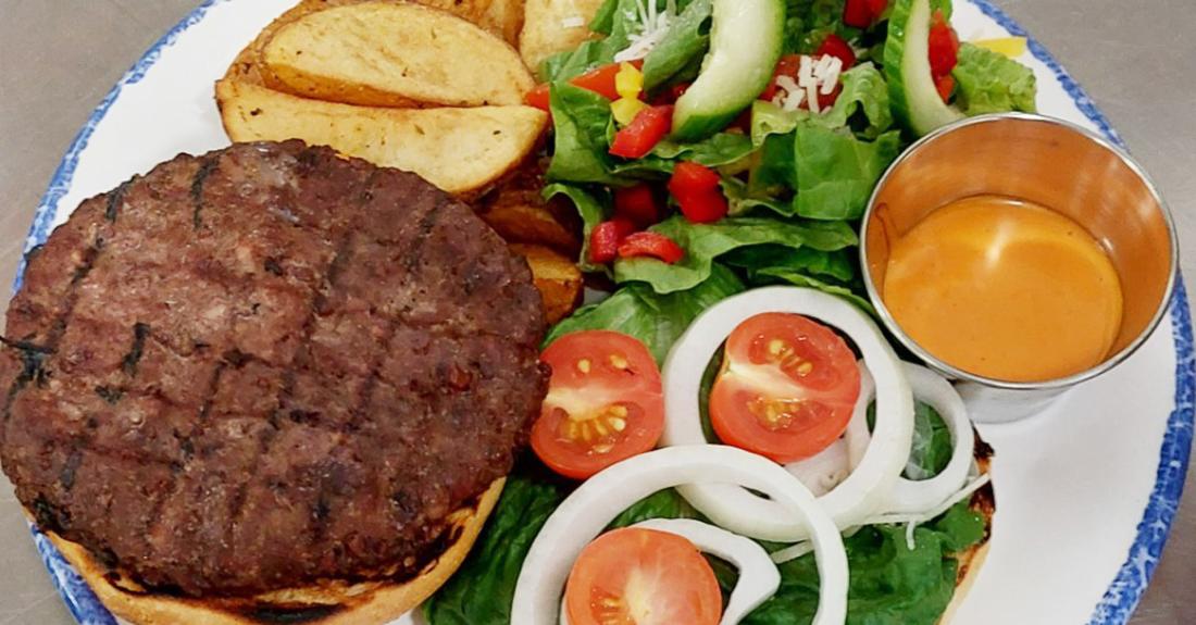 Hamburger and salad on a plate
