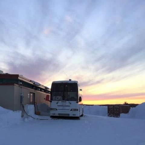 Photo of Clara Bus parked in Wemindji during a sunset in winter