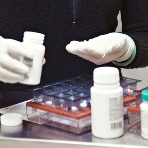 Closeup of pills being counted out