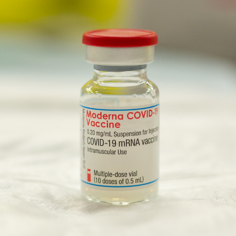 Bottle of Moderna vaccine on table