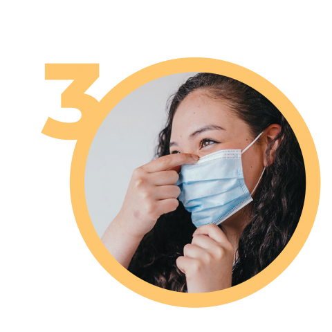 Woman adjusts medical mask to nose and chin