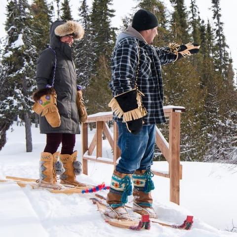 Man and woman snowshoeing