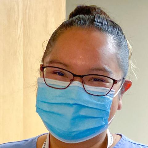 Woman with glasses wearing medical mask