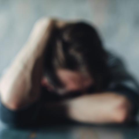 Out of focus photo of youth in despair