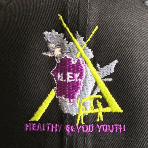 Healthy Eeyou Youth logo on black fabric